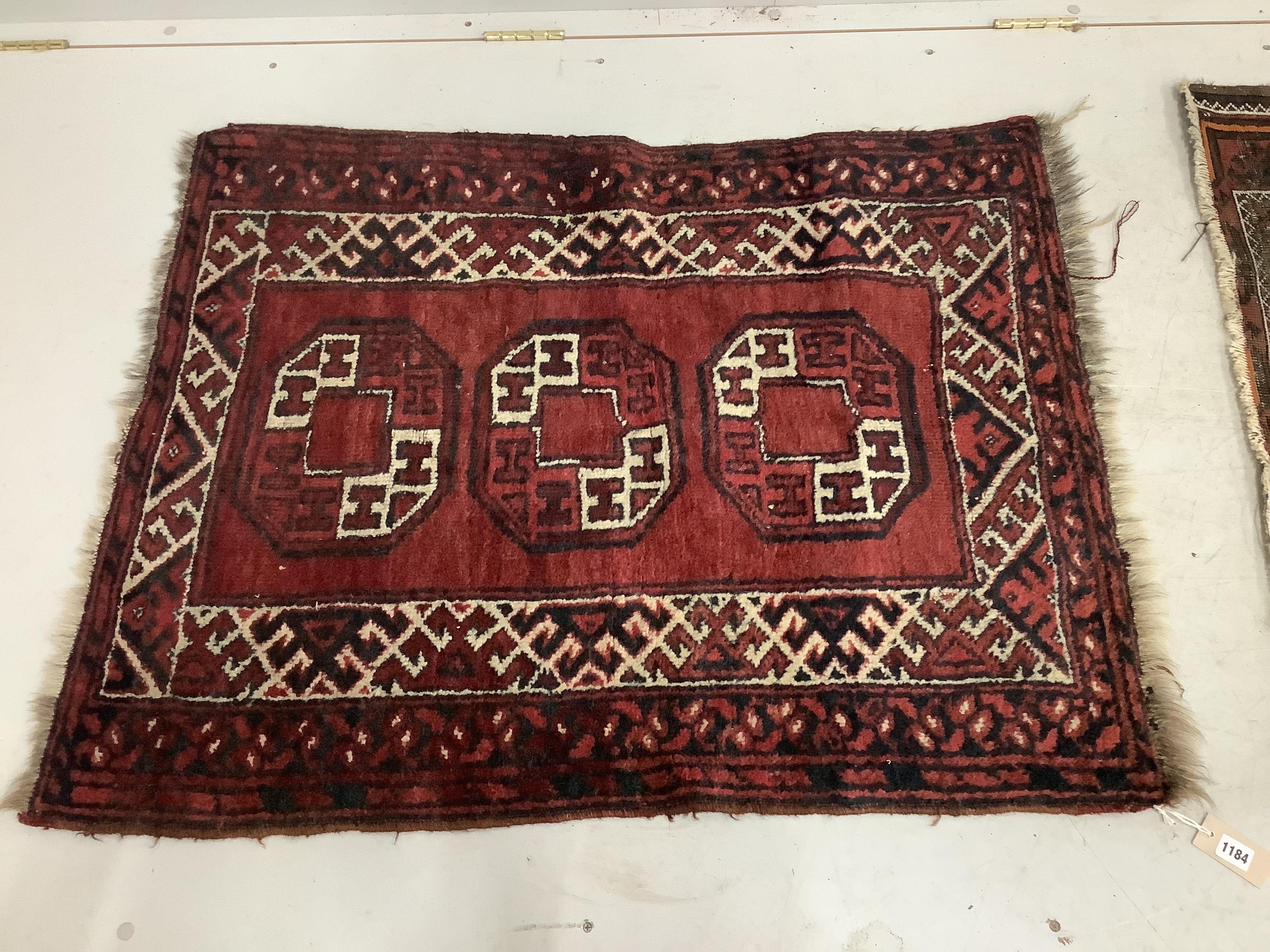 A Caucasian blue ground rug, worn together with an Afghan style rug, larger 140 x 85cm